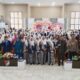 Dokumentasi bersama Bupati Tojo Una-Una Ilham Lawidu, para pejabat daerah, dan ratusan anggota Ikatan Bidan Indonesia (IBI) dalam acara peringatan HUT IBI ke-75 Tahun 2026 di Gedung Auditorium, Rabu (24/6/2026).